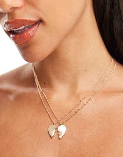 Collana dorata con cuore a metà - Monki - Modalova