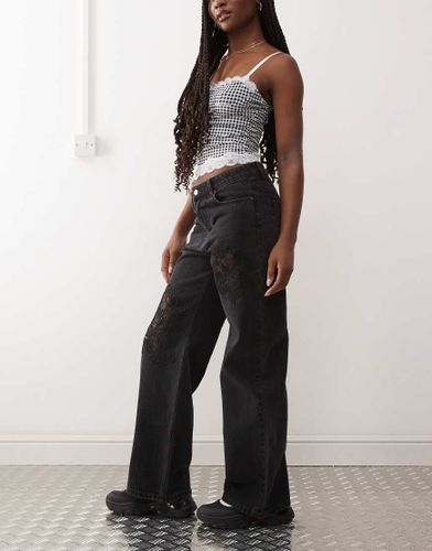 Missy - Jean ample à taille basse avec découpe à dentelle - Monki - Modalova