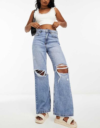 Jeans ampi lavaggio medio con strappi sulle ginocchia - Miss Selfridge - Modalova