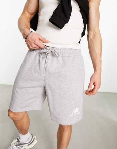 Essentials Stacked - Pantaloncini ini pile grigi con logo - New Balance - Modalova