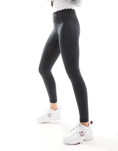 NB - Leggings neri a vita alta da 27" con tasca - New Balance - Modalova