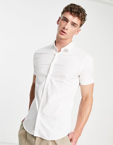 Camicia attillata a maniche corte in popeline bianca - New Look - Modalova