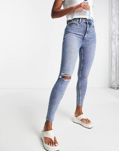 Jeans skinny con strappi lavaggio medio - New Look - Modalova