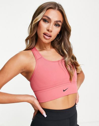 Reggiseno sportivo a sostegno medio con logo Nike - Nike Training - Modalova