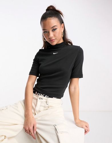 Essential - Top nero a coste con logo piccolo e collo alto - Nike - Modalova