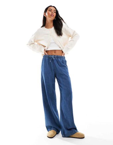 Pantaloni in denim scuro - Stradivarius - Modalova