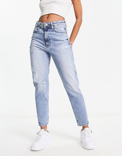 Mom jeans a vita alta medio con strappi - River Island - Modalova