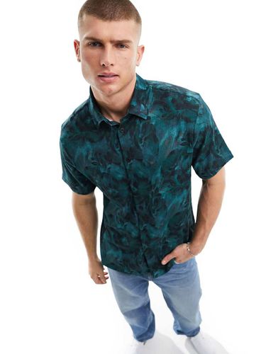 Camicia stropicciata a maniche corte verde-azzurro a fiori - River Island - Modalova