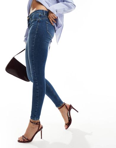 Jean skinny sculptant à taille mi-haute - moyen délavé - River Island - Modalova