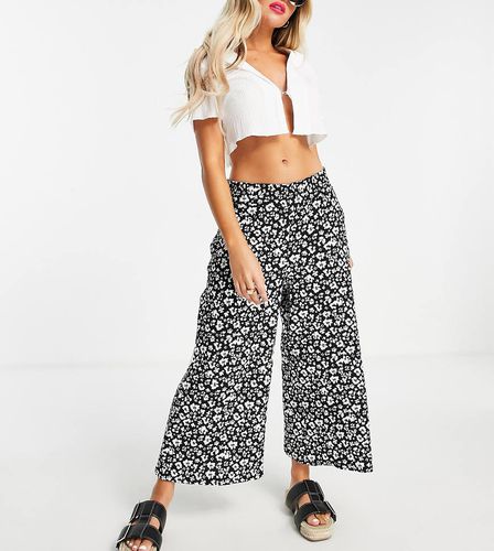 Pantaloni culotte neri a fiori con vita arricciata - River Island Petite - Modalova