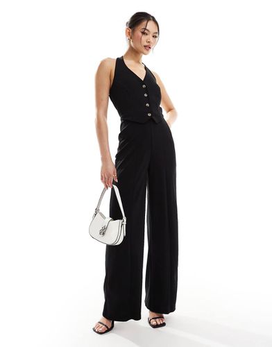 Tuta jumpsuit nera allacciata al collo - River Island - Modalova