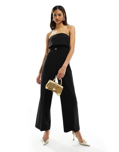 Tuta jumpsuit sartoriale a fascia nera - River Island - Modalova