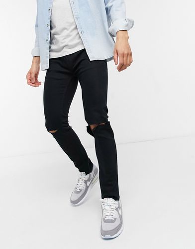 Jeans skinny in misto cotone elasticizzato con strappi - BLACK - Topman - Modalova