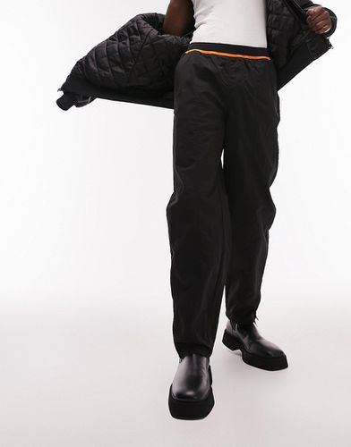 Pantaloni ampi in nylon con elastico arancione fluo in vita - Topman - Modalova