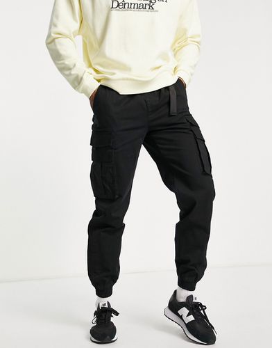 Pantaloni cargo skinny neri con pannello laterale e cintura - Topman - Modalova