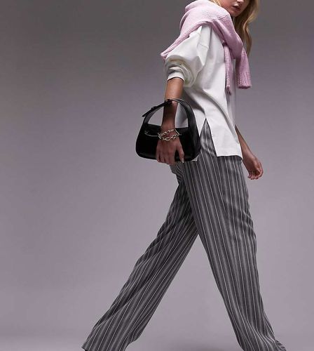 Pantaloni a vita bassa a righe - Topshop Tall - Modalova