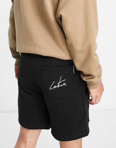 Pantaloncini in jersey neri con logo stampato in coordinato - The Couture Club - Modalova