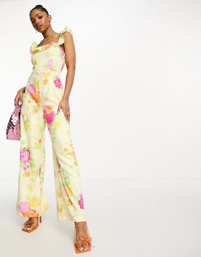 Bloom - Tuta jumpsuit a fiori con volant e fondo ampio - The Frolic - Modalova