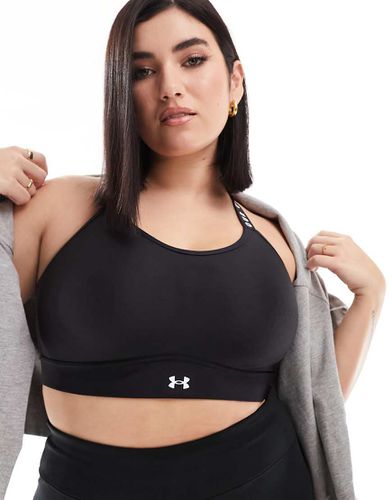 Plus - Reggiseno sportivo a sostegno medio con incrocio sul retro - Under Armour - Modalova