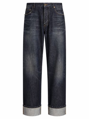 Jeans in denim con logo ricamato - dolce & gabbana - Modalova