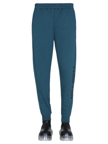 Jogging pants with logo print - helmut lang - Modalova