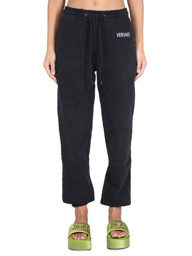 Versace jogging pants with logo - versace - Modalova