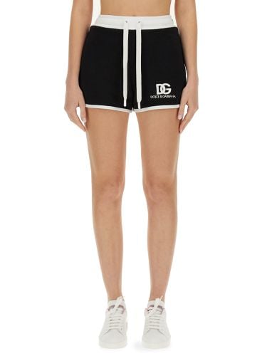 Shorts with logo embroidery - dolce & gabbana - Modalova