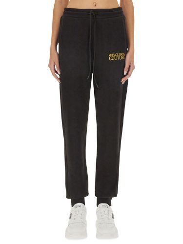 Jogging pants with logo - versace jeans couture - Modalova