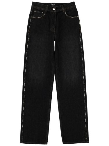 Jeans with studs and crystals decoration - versace - Modalova