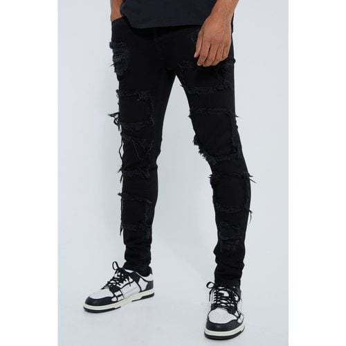 Jeans Skinny Fit strappati con pieghe sul fondo e smagliature - boohoo - Modalova