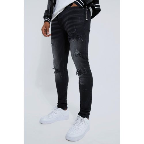 Jeans stile Biker Skinny Fit Stretch con strappi & rattoppi - boohoo - Modalova