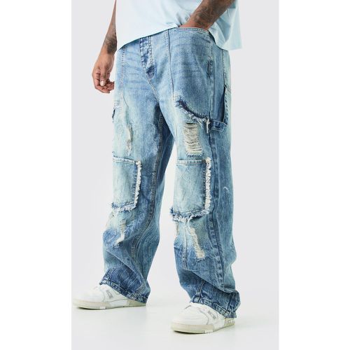 Jeans Cargo Plus Size rilassati in denim rigido con strappi - boohoo - Modalova