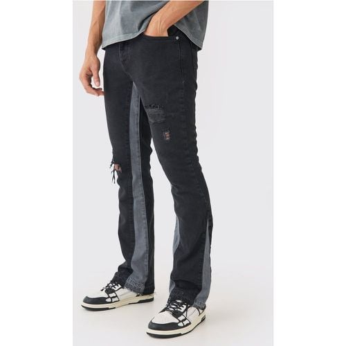 Jeans a zampa Slim Fit con pannelli e smagliature - boohoo - Modalova