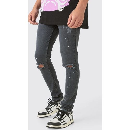 Jeans Skinny Fit in Stretch con strappi e schizzi di colore - boohoo - Modalova