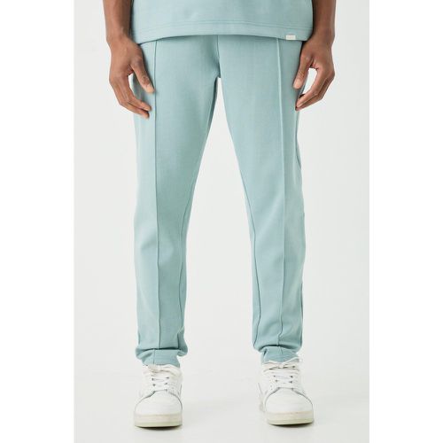 Pantaloni tuta affusolati Slim Fit con nervature e nervature - boohoo - Modalova