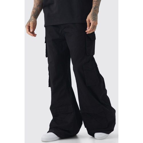Pantaloni Tall super extra larghi in denim rigido con tasche Cargo - boohoo - Modalova