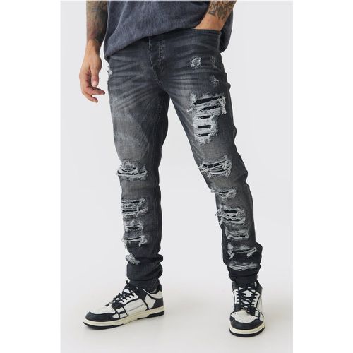 Jeans stile Biker Skinny Fit Stretch neri in PU con strappi & rattoppi - boohoo - Modalova