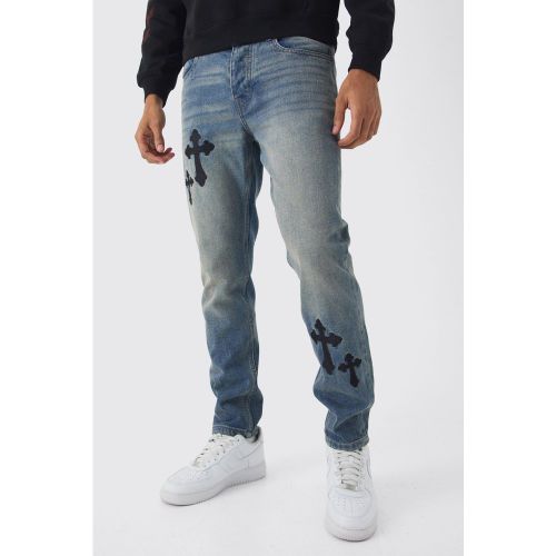 Jeans Slim Fit in denim rigido con ricami incrociati - boohoo - Modalova