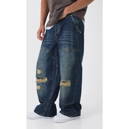 Jeans extra comodi in denim rigido stile Carpenter con strappi in lavaggio sporco - boohoo - Modalova