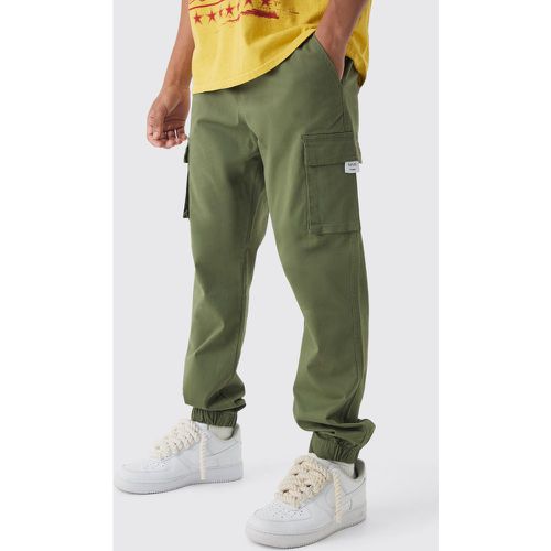 Slim Fit Elasticated Waist Woven Tab Cuffed Cargo Trousers - boohoo - Modalova