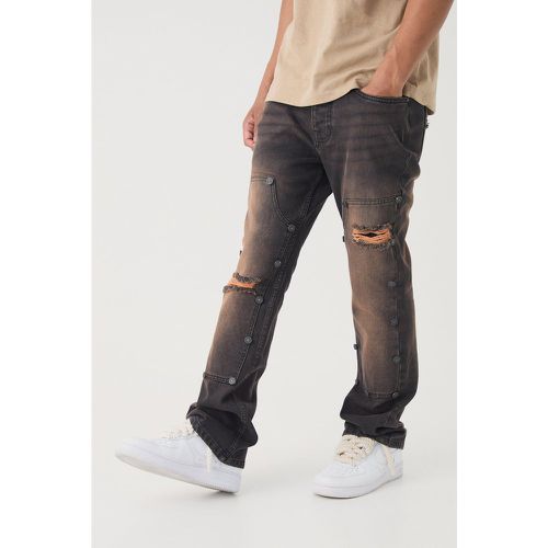 Jeans a zampa Slim Fit in denim rigido in lavaggio vintage con strappi stile Carpenter - boohoo - Modalova