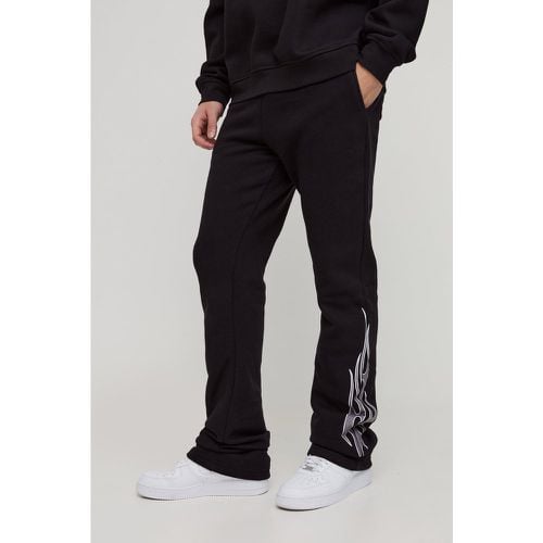 Pantaloni tuta Slim Fit a zampa con fiamme - boohoo - Modalova