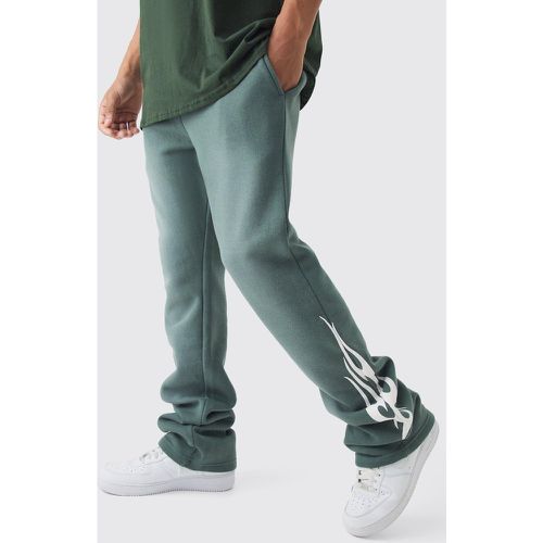 Pantaloni tuta Slim Fit a zampa slavati con fiamme - boohoo - Modalova