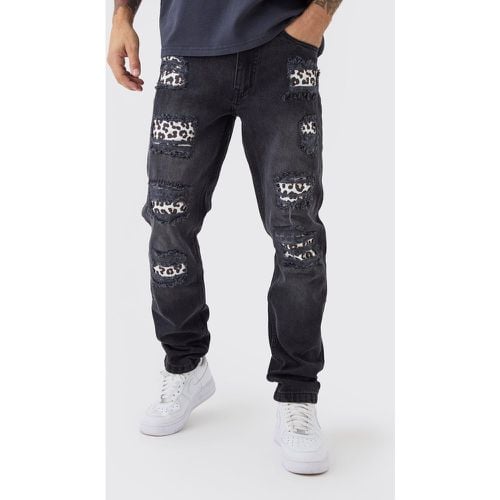 Jeans Slim Fit con stampa leopardata e strappi & rattoppi - boohoo - Modalova