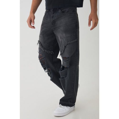 Jeans rilassati stile Carpenter con strappi e smagliature - boohoo - Modalova