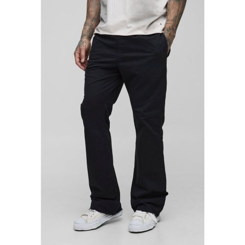 Pantaloni a zampa Tall con vita elasticizzata - boohoo - Modalova