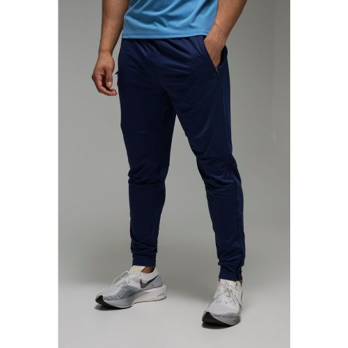 Pantaloni tuta affusolati Man Active Stretch con zip sul fondo - boohoo - Modalova