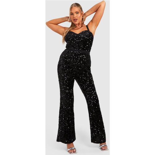 Tuta intera a gamba ampia Plus Size in velluto con paillettes e spalline - boohoo - Modalova