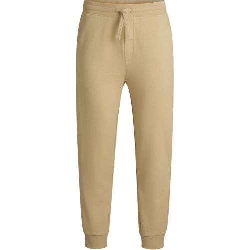 Bas de survêtement en molleton de coton avec logo contrastant - HUGO - Modalova