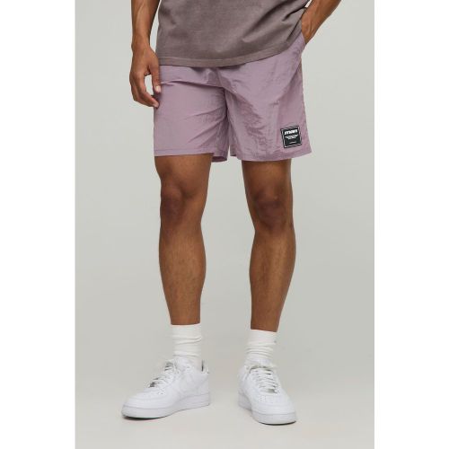 Pantaloncini rilassati in nylon effetto goffrato extra lucido - boohoo - Modalova